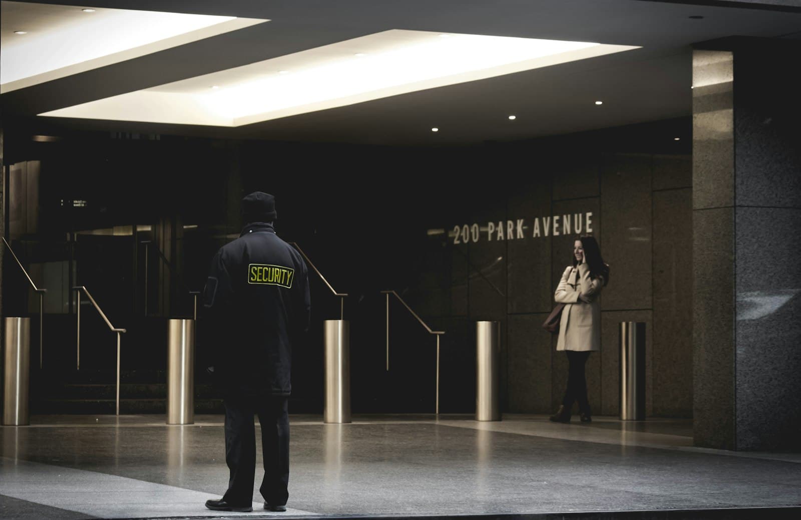 Q Axis security officer on duty in a building lobby